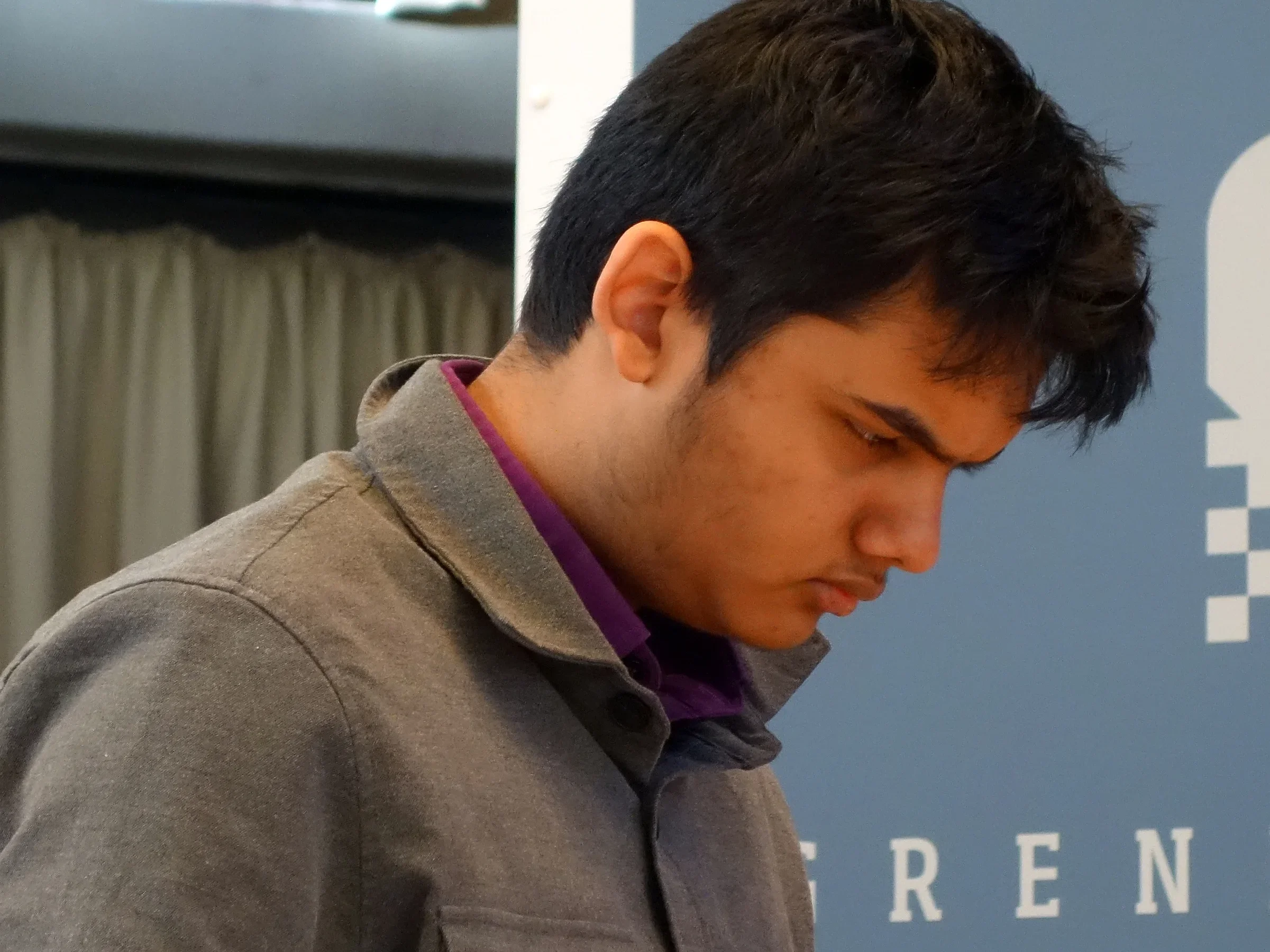 Abhimanyu Mishra looking down at the board during a game