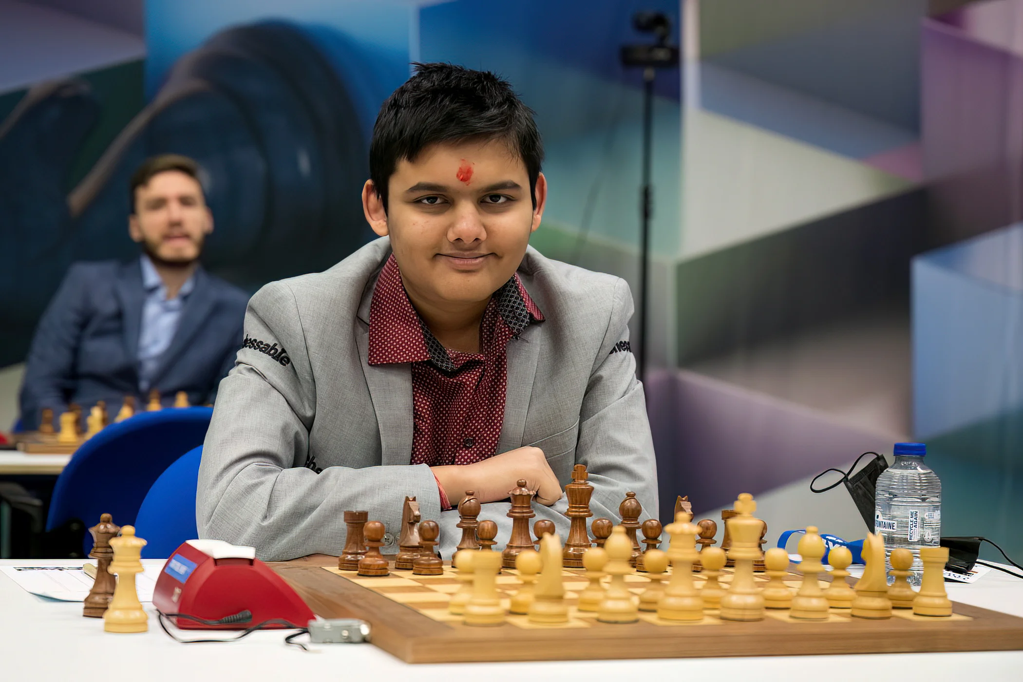 Abhimanyu Mishra smiling at the board at the 2023 Tata Steel tournament