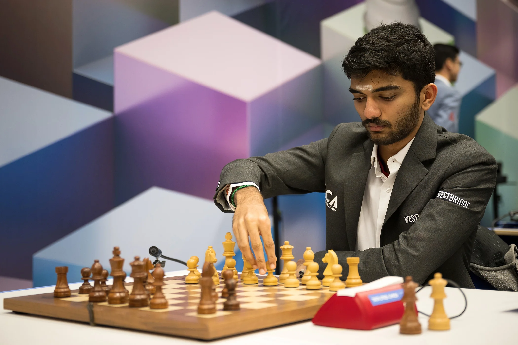 Gukesh Dommaraju moving a piece during a game at the 2025 Tata Steel Chess Tournament